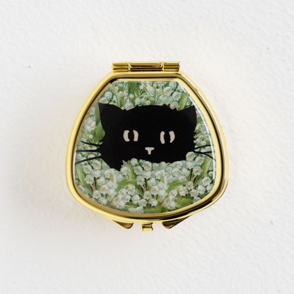 BLACK CAT IN LILY OF VALLEY